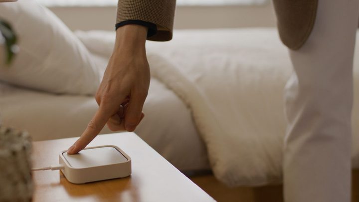 A person using a Samsung SmartThings device.