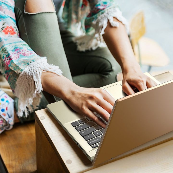 Acer Swift 60 back view showing user typing.