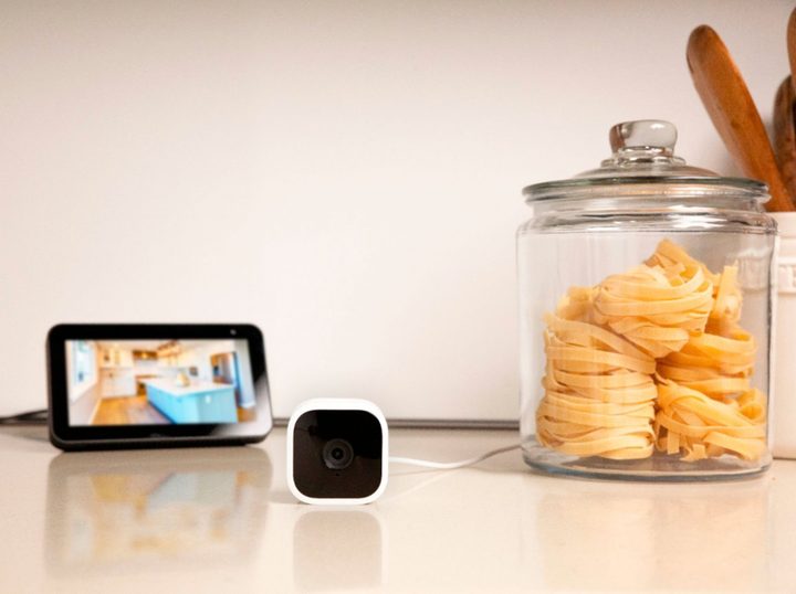Blink Mini Indoor 1080p wireless security camera on a counter showing video capture on an Echo Show display.