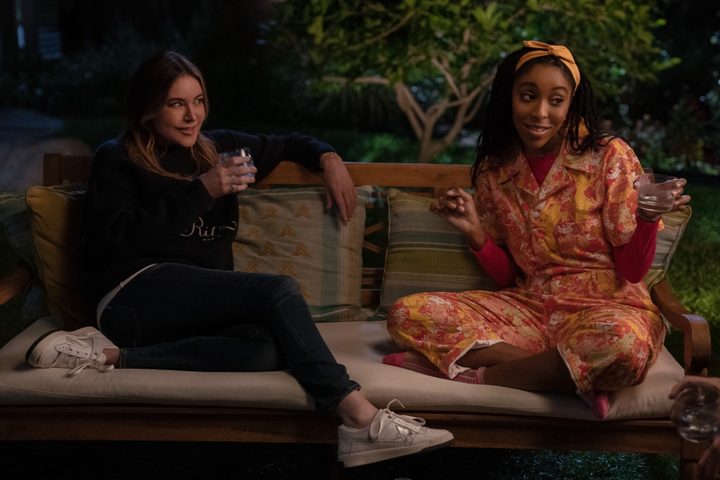 Christa Miller and Jessica Williams sit on a couch together in Shrinking.