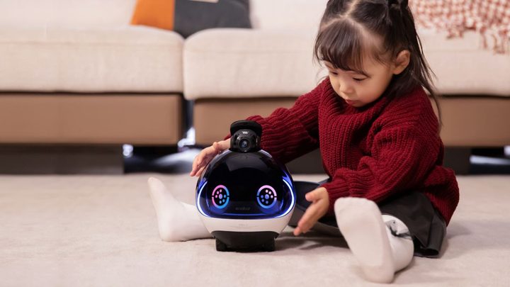 A child playing with the EBO X.