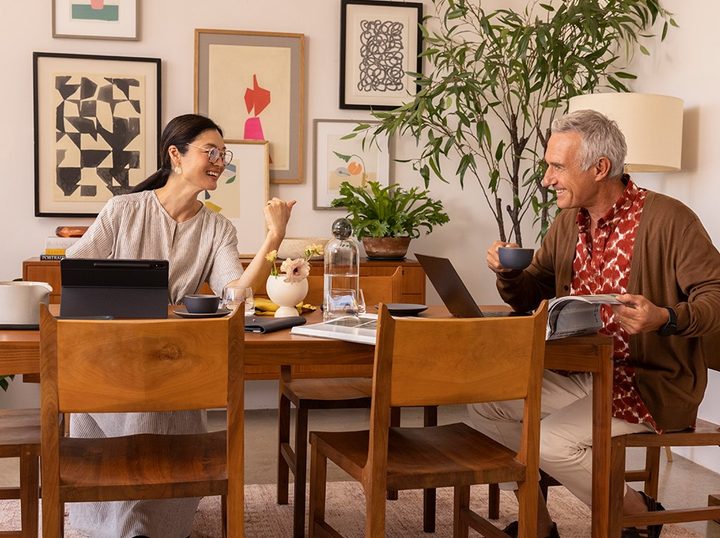 Family using internet in the dining room