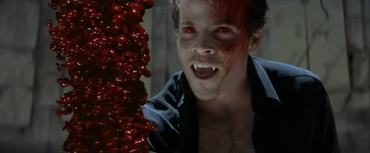 Deacon Frost with a bloody hand in "Blade" (1998).
