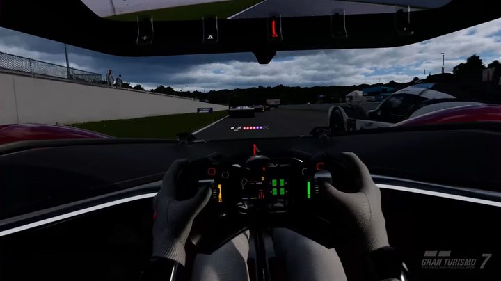 A driver holds a wheel in a car in Gran Turismo 7 VR.
