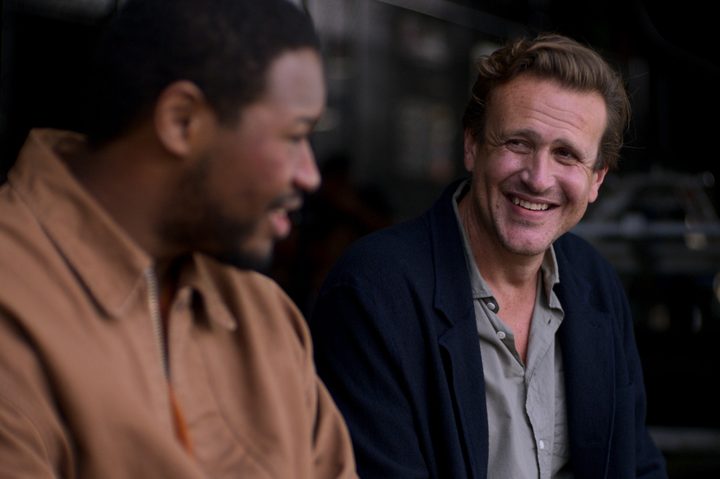 Jason Segel looks at Luke Tennie in Shrinking.