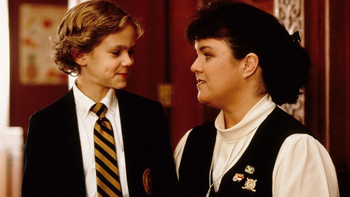 A young boy and a nun looking at each other in the movie Wide Awake.