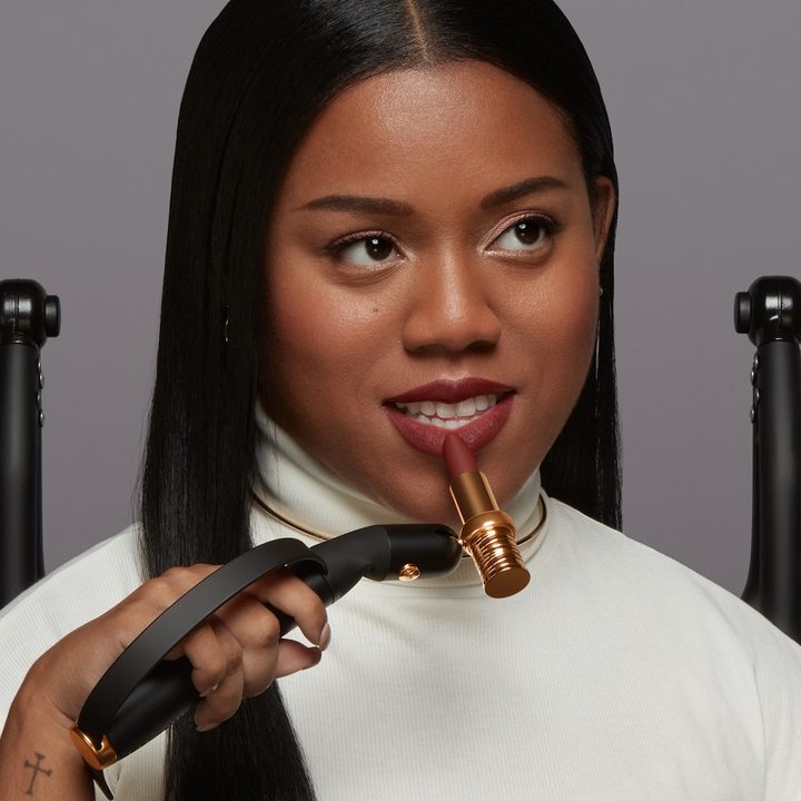L'Oreal Hapta smart makeup applicator being used to apply lipstick.