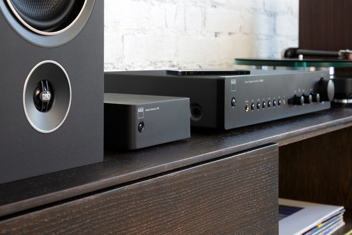 The NAD CS1 Endpoint Network Streamer on a wood media console.