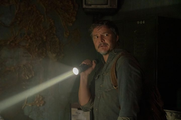 Pedro Pascal holds a flashlight in The Last of Us.