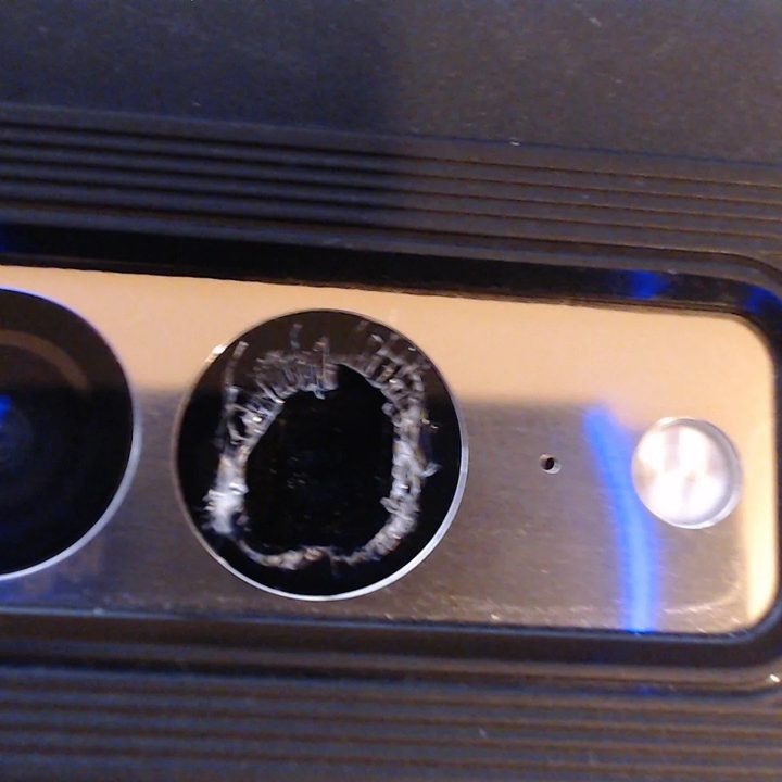Photo of a Pixel 7 with shattered glass over the rear camera.