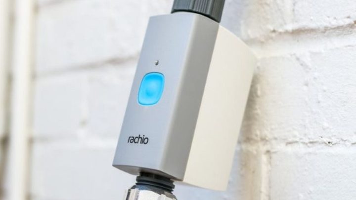 The Rachio Smart Hose Timer installed on an outdoor spigot.