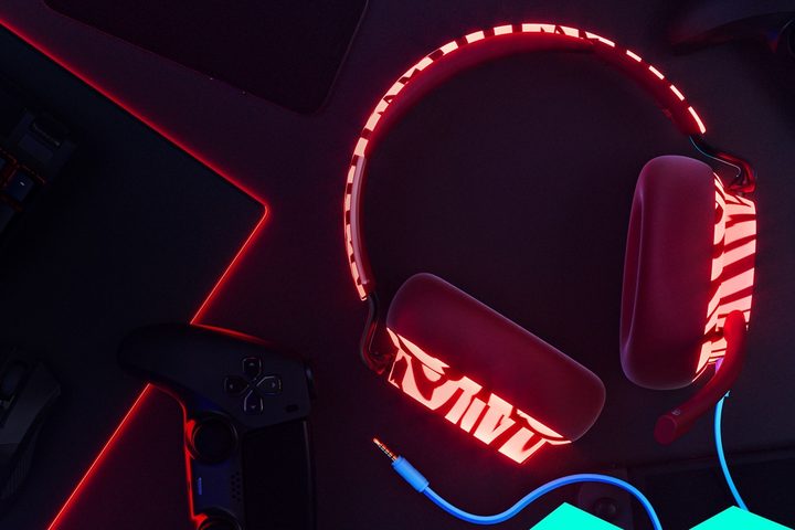 Skullcandy x Doritos SLYR multi-platform gaming headset seen glowing in the dark.