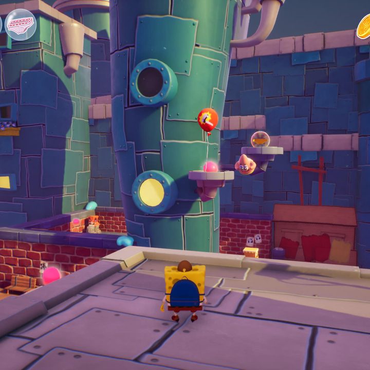 spongebob looks at golden underwear from atop a building