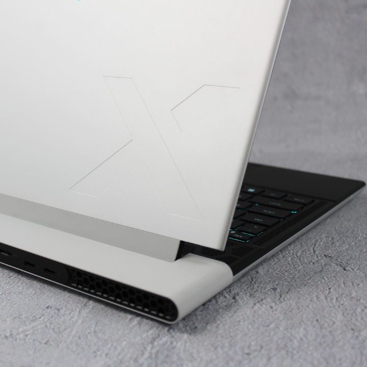 The lid of the Alienware x14 R2 against a grey background.