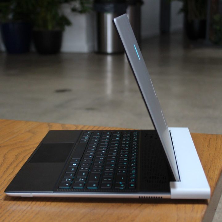 The side profile of the Alienware x14 R2 on a table.