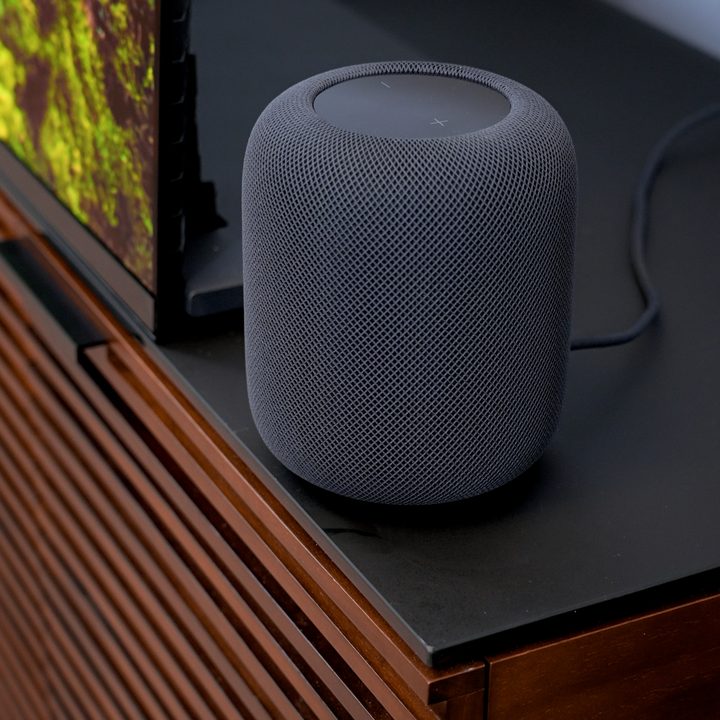 An Apple HomePod 2023 on a media console.