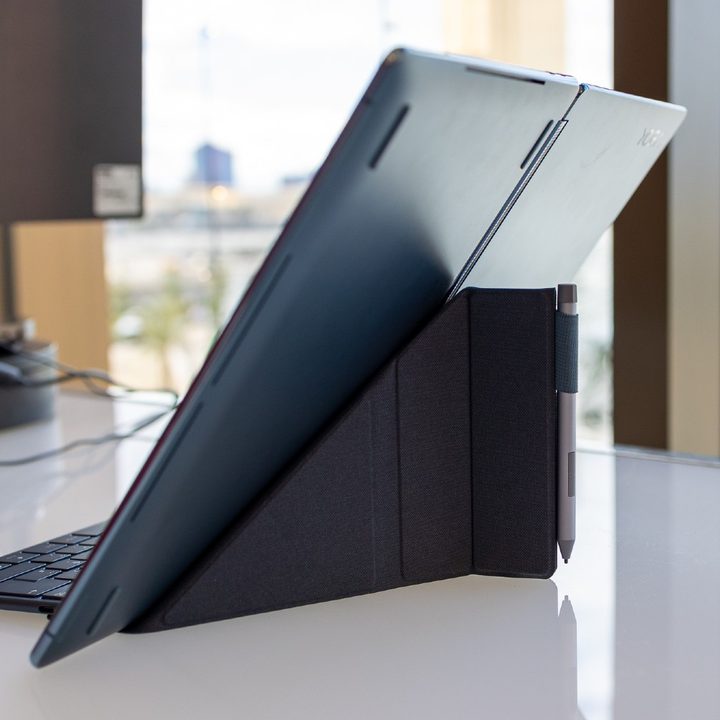 The Lenovo Yoga Book 9i sitting on origami stand.