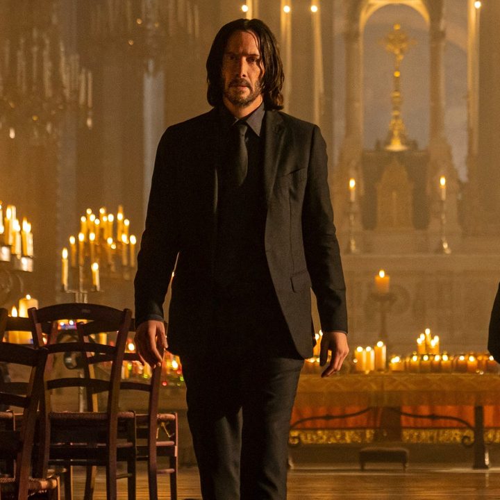 Keanu Reeves stands in a church in John Wick: Chapter 4.