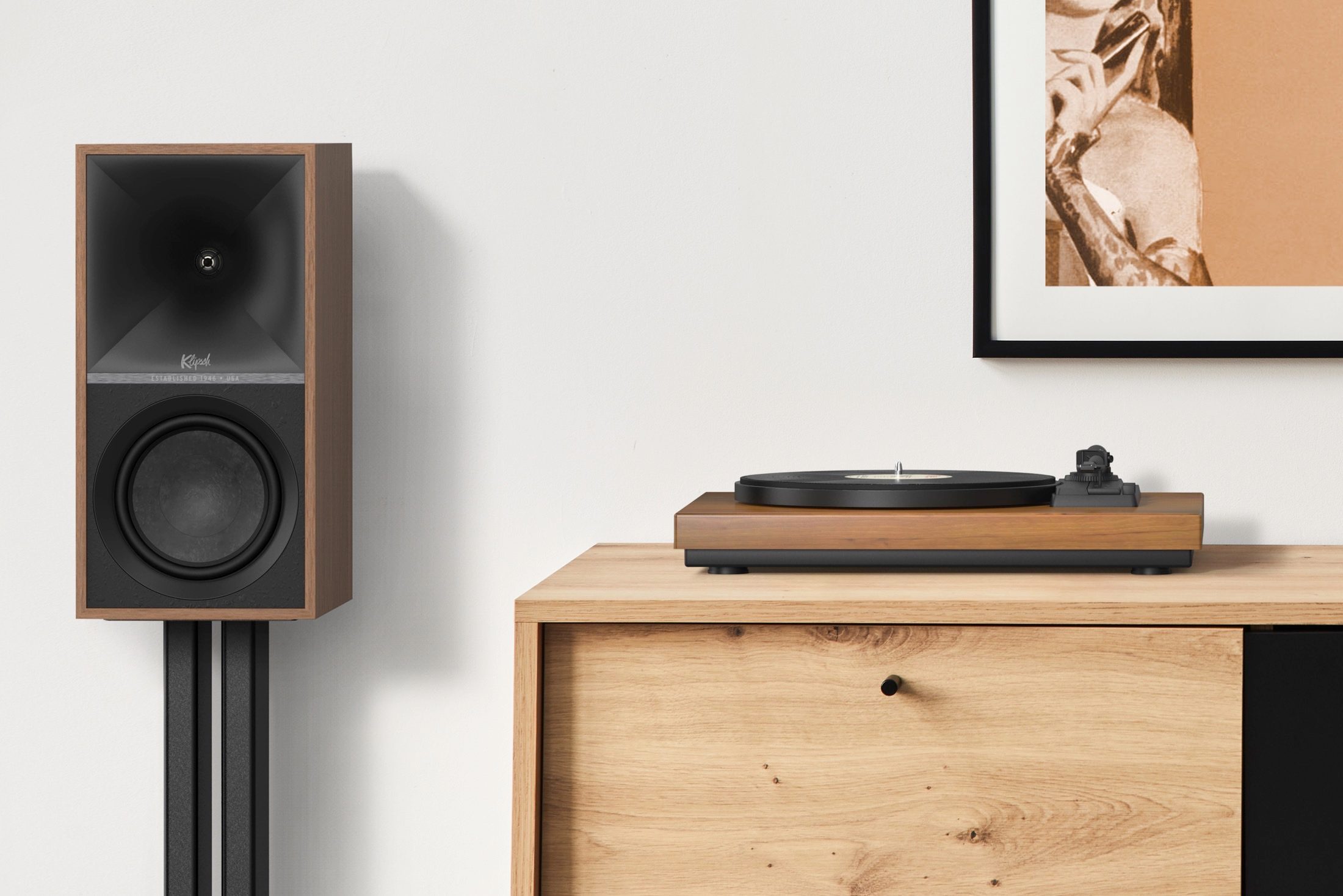 Klipsch The Sevens in walnut finish next to a turntable.