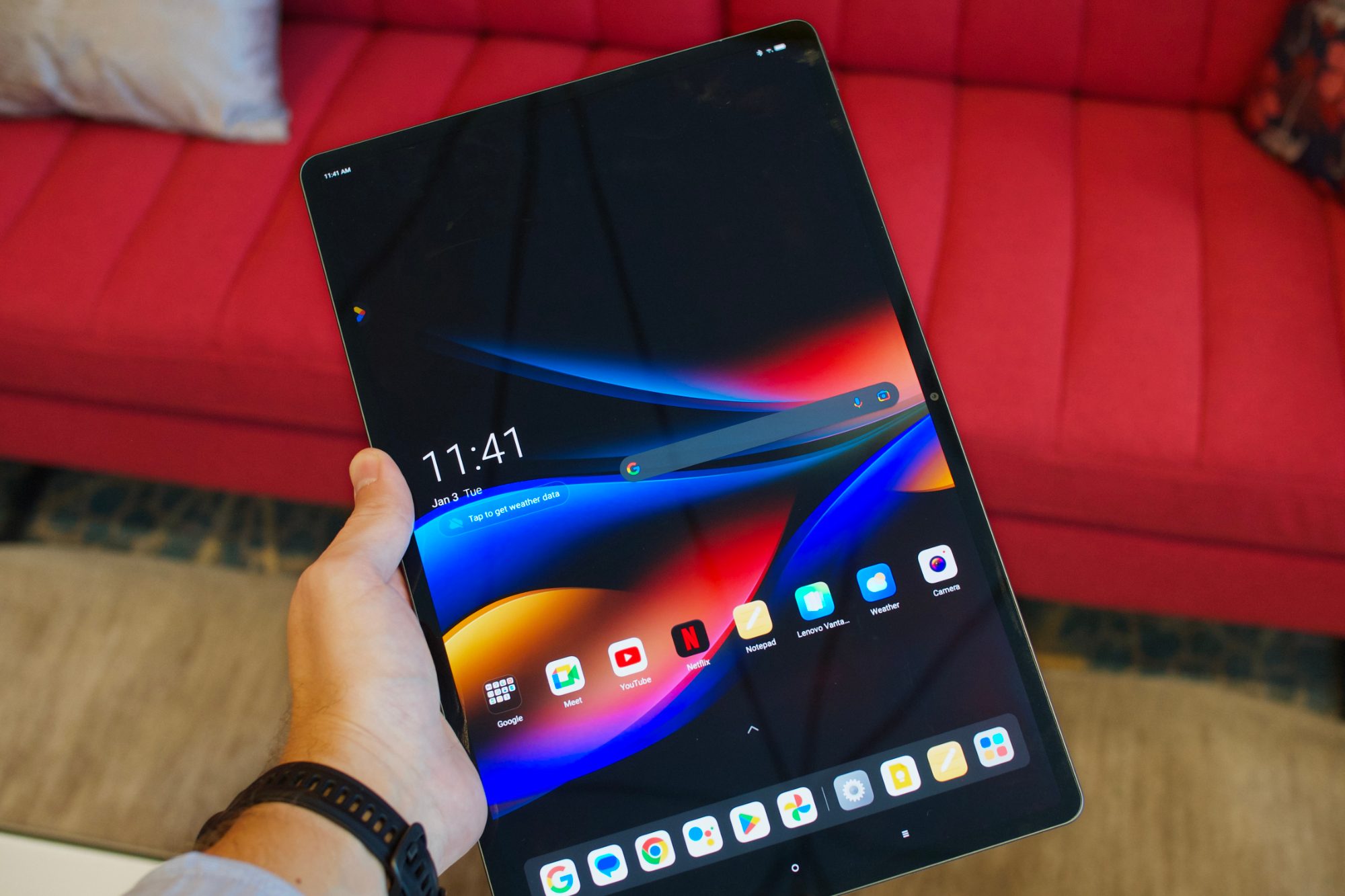 Holding the Lenovo Tab Extreme.