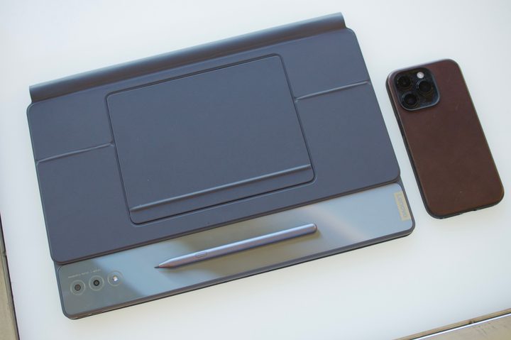 Lenovo Tab Extreme next to an iPhone 14 Pro.