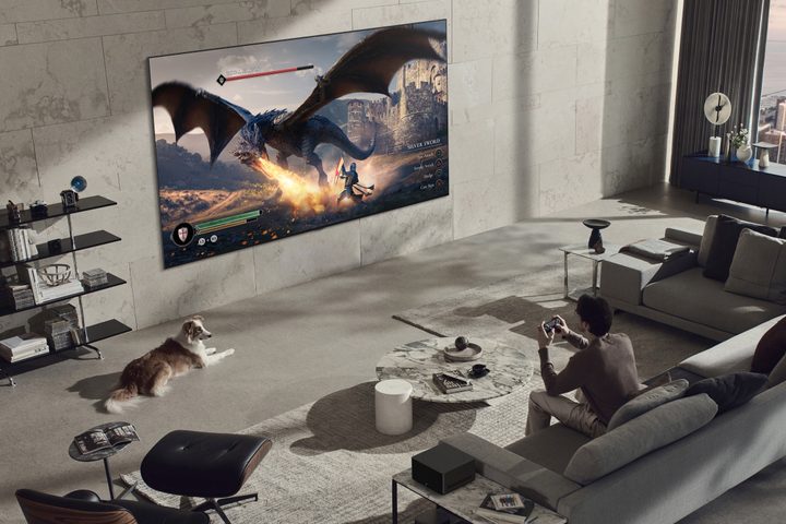 Man playing a video game on an LG 97-inch Signature OLED M3 4K TV.