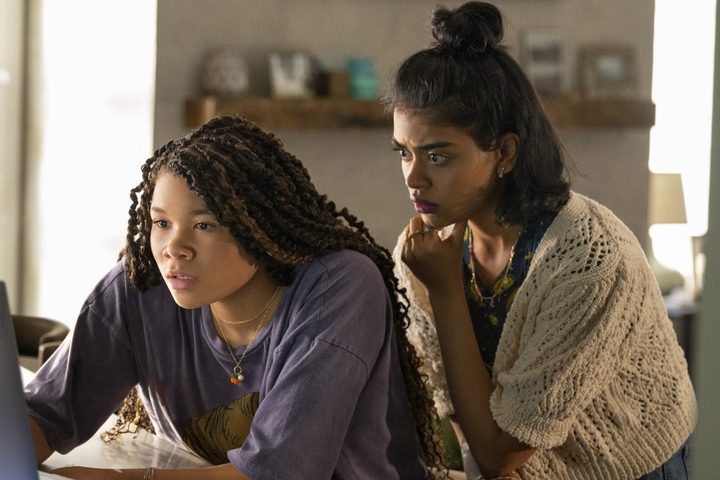 Two girls look at a computer screen in Missing.