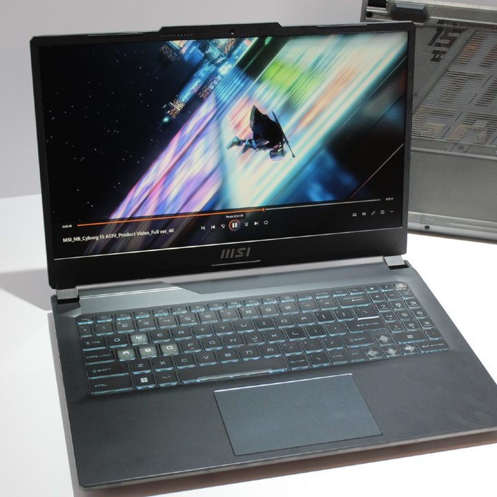 The MSI Cyborg 15 gaming laptop on a white table.