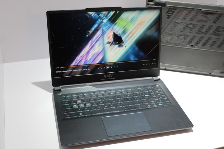 The MSI Cyborg gaming laptop on a white demo table.