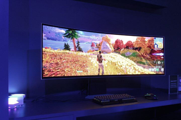 The Samsung Odyssey OLED 49 in a blue-tinted room.