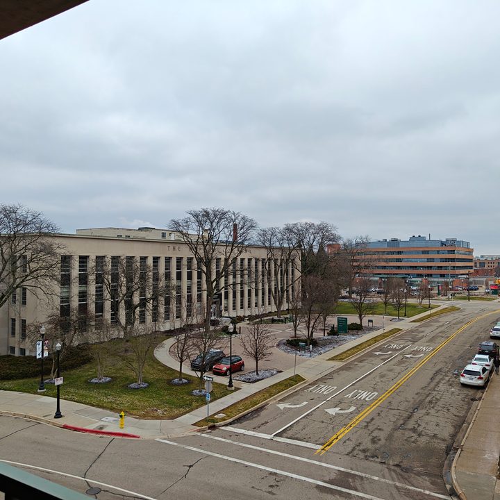 Photo of a building and street during an overcast afternoon in Michigan.