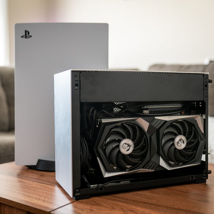 A mini PC sitting in front of the PS5.