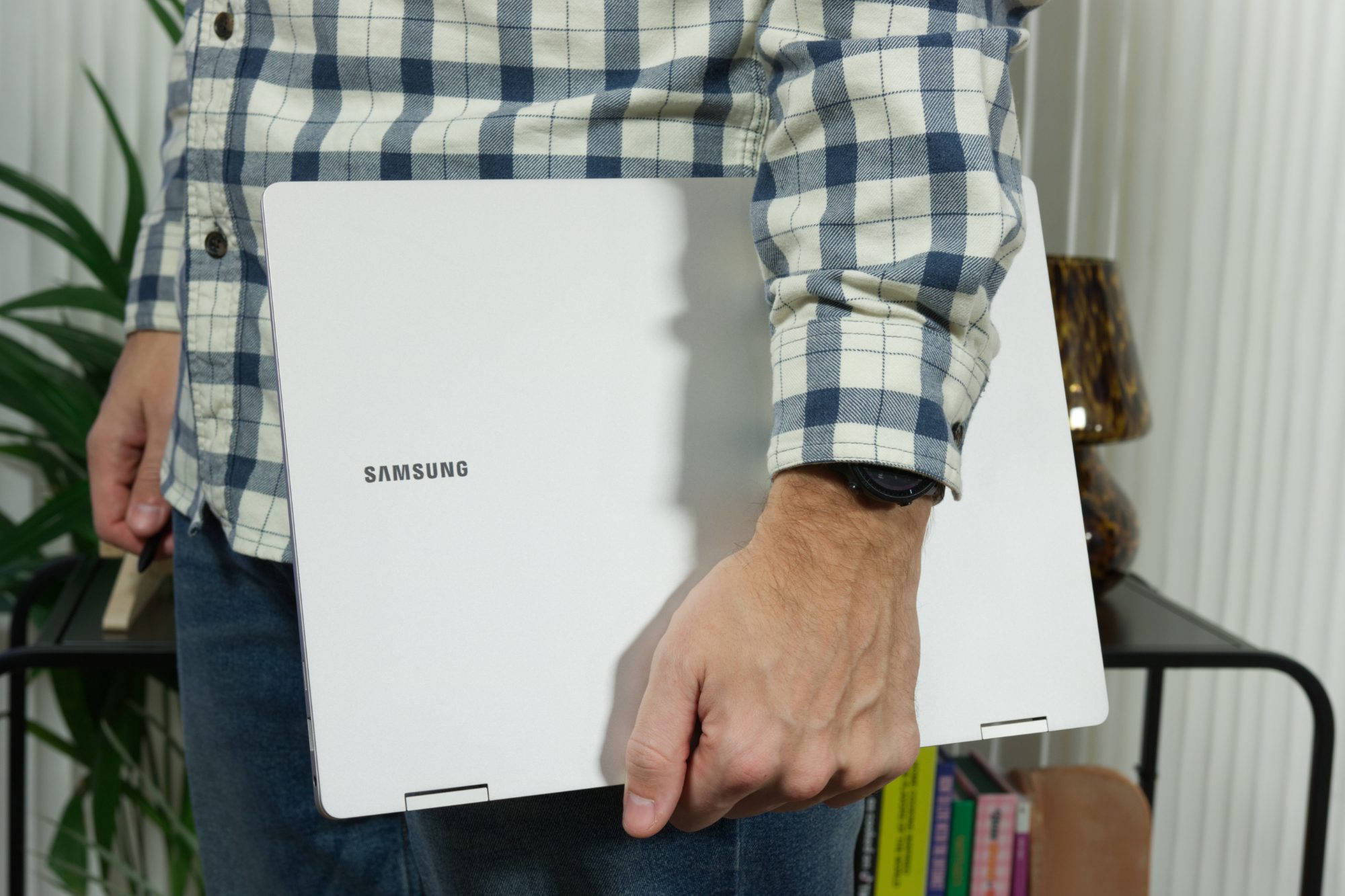 Someone holding the Samsung Galaxy Book 3 Pro 360.
