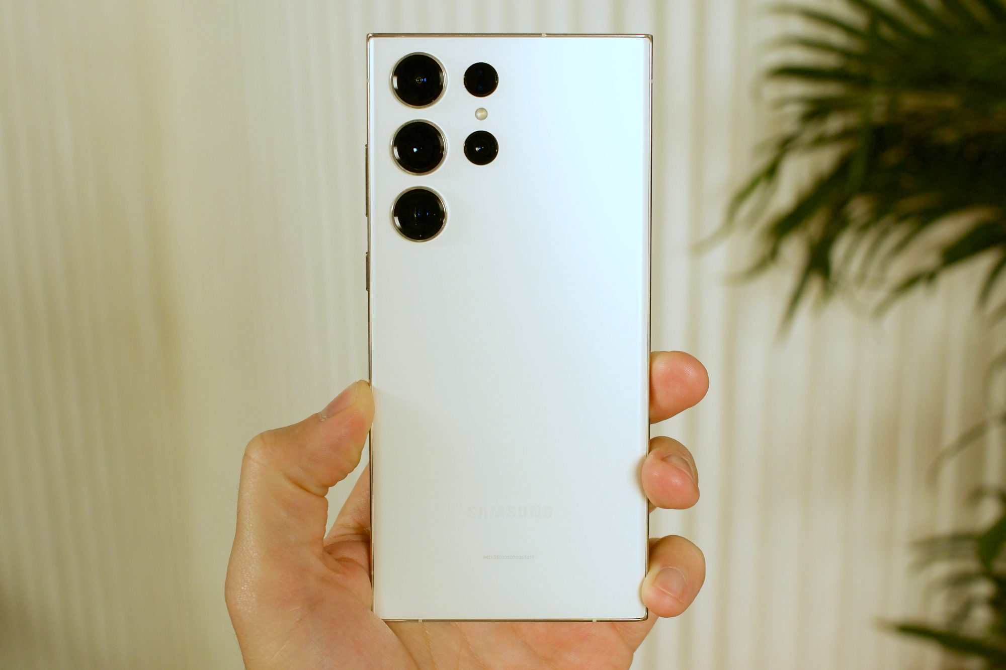 The back of the white Samsung Galaxy S23 Ultra.