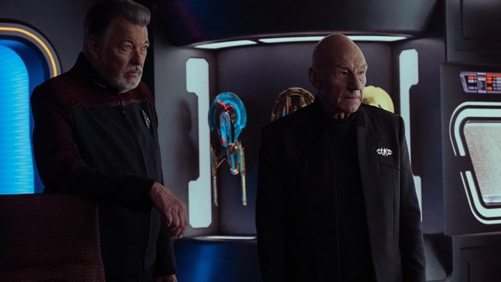 Picard and another character looking at something in a scene from Star Trek: Picard.