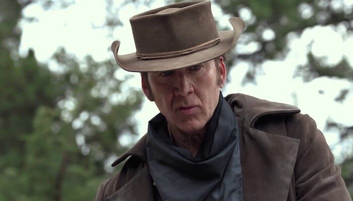 Nicolas Cage scowls at the camera in a scene from The Old Way.
