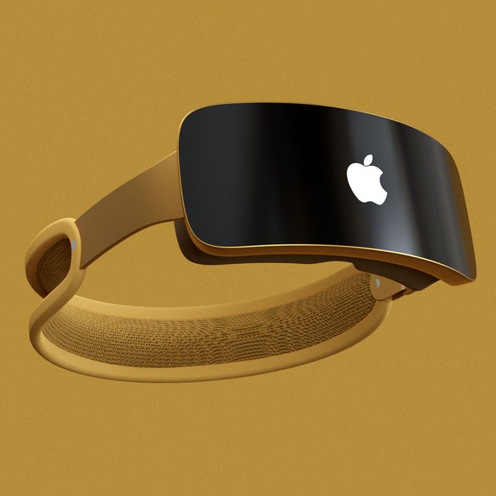 A rendering of an Apple mixed-reality headset (Reality Pro) in a gold color seen from the front.