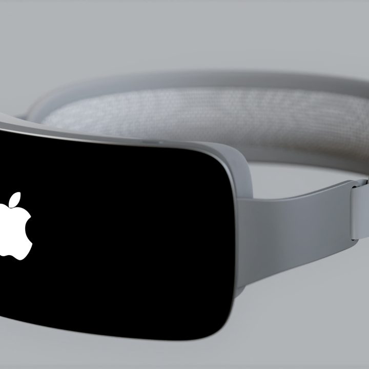 A rendering of an Apple mixed-reality headset (Reality Pro) in a gray color seen from the front.