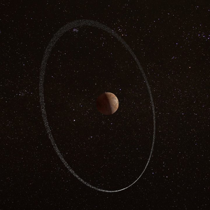 An artist’s impression of the dwarf planet Quaoar and its ring. Quaoar’s moon Weywot is shown on the left. Quaoar’s ring was discovered through a series of observations that took place between 2018 to 2021. Using a collection of ground-based telescopes, and ESA’s space-based telescope Cheops, astronomers watched as Quaoar crossed in front of a succession of distant stars, briefly blocking out their light as it passed.