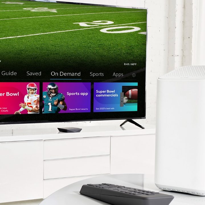 A Comcast cable box, remote, and TV.
