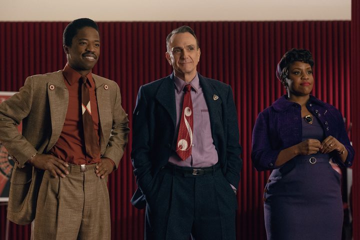 Dewshane Williams, Hank Azaria, and Haneefah Wood stand together in Hello Tomorrow.