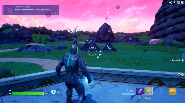 Character by rocks in Fortnite.