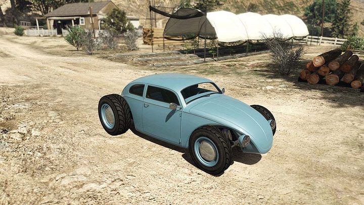 A blue car with big wheels.