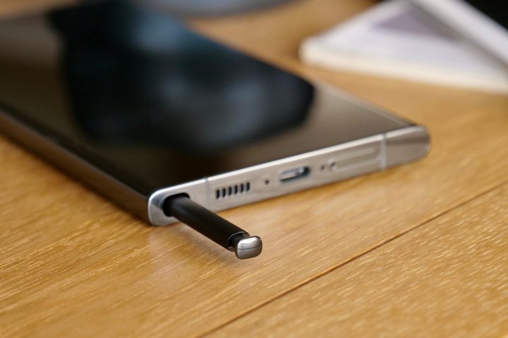 The Galaxy S23 Ultra with the S Pen poking out from its compartment.