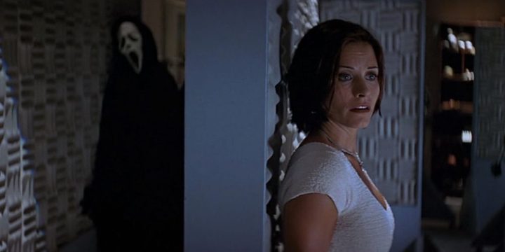 Ghostface stalks Gale Weathers through an empty sound studio.