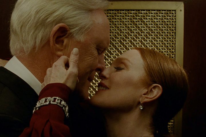 Julianne Moore touches John Lithgow's face in Sharper.