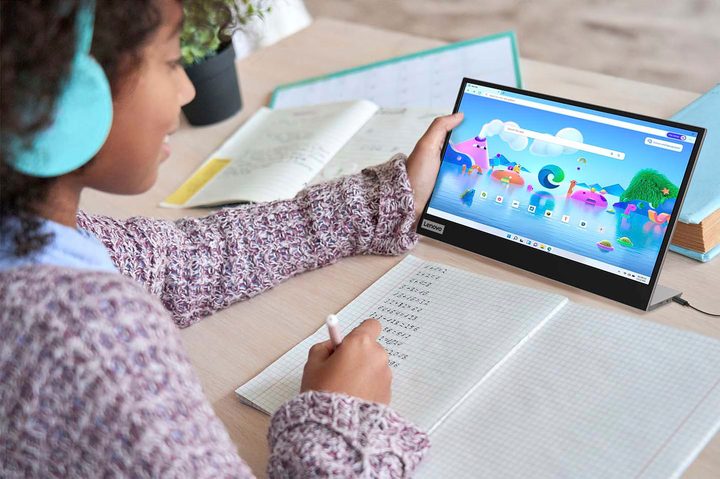 Someone using the Lenovo L15 Portable Monitor.