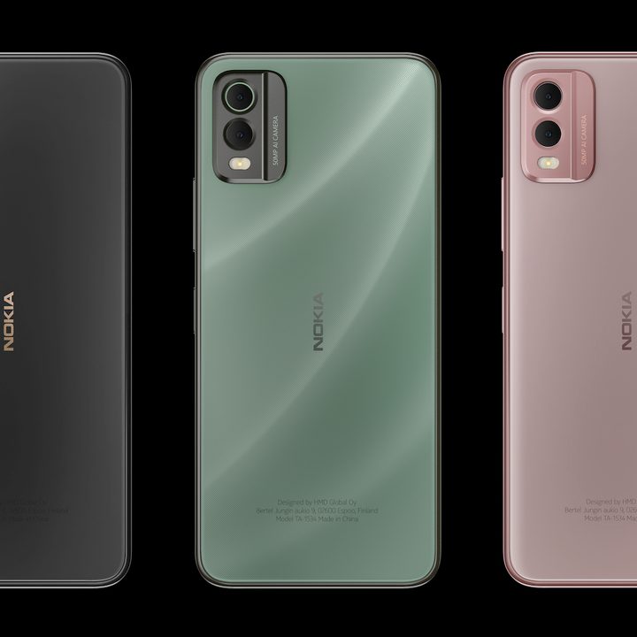 The Nokia C32 in its three colors, black, green, and pink.
