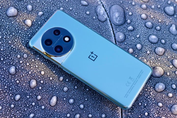 The back of the OnePlus 11 against some ice.