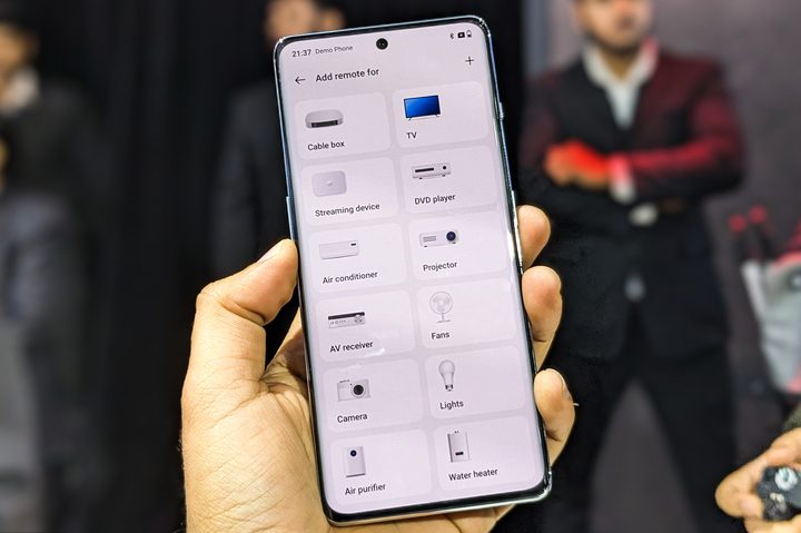 IR blaster app on the OnePlus 11R held in hald.